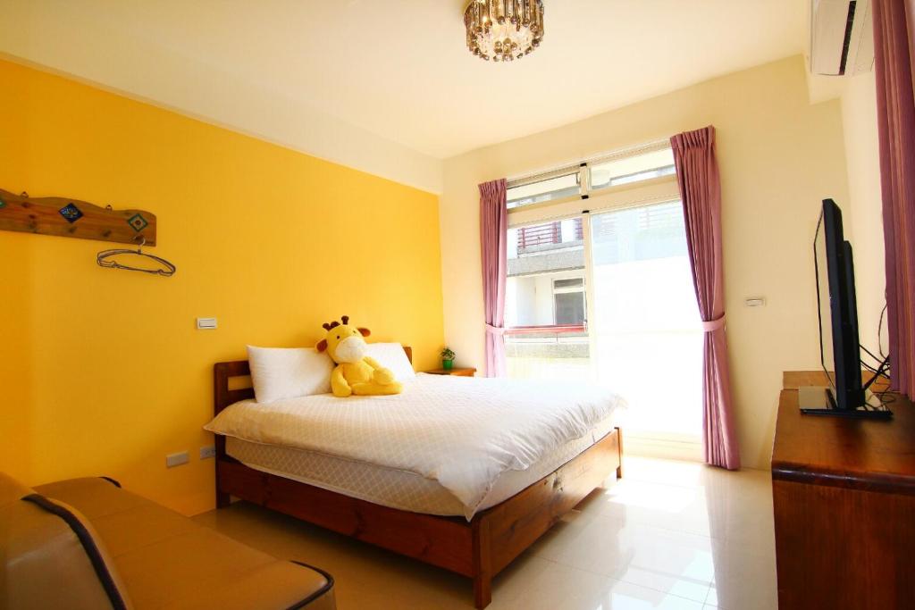 Postel nebo postele na pokoji v ubytování Yilan B&B - Happy Snail