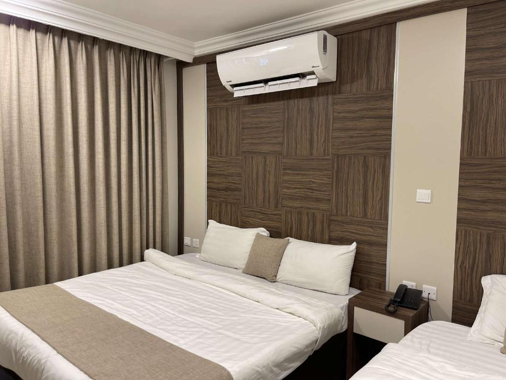 Postel nebo postele na pokoji v ubytování mass paradise2