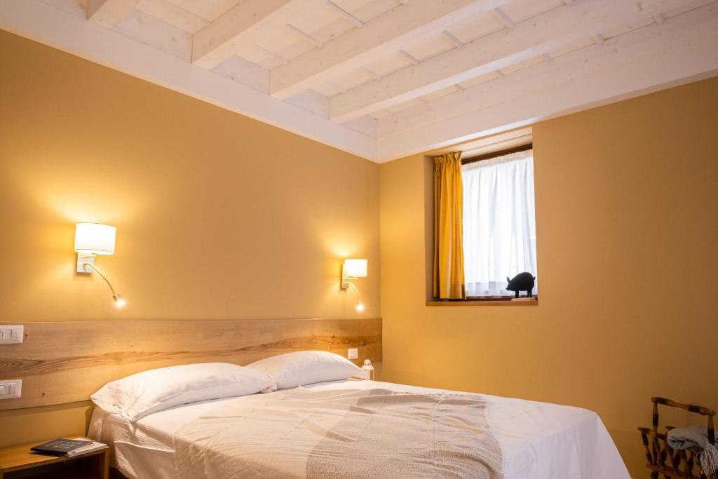 Postel nebo postele na pokoji v ubytování Cascina Bagaggera