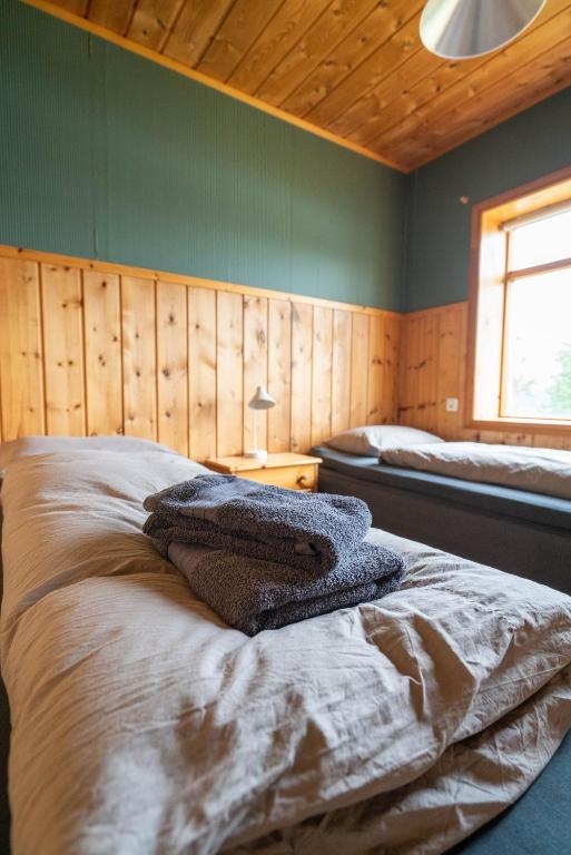 Ένα ή περισσότερα κρεβάτια σε δωμάτιο στο Hengifosslodge Skáldahús