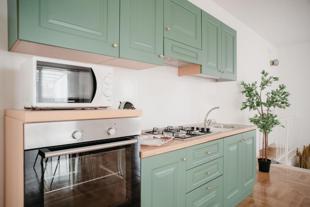 A kitchen or kitchenette at Vista Napoli Residence by Casa Napoletana