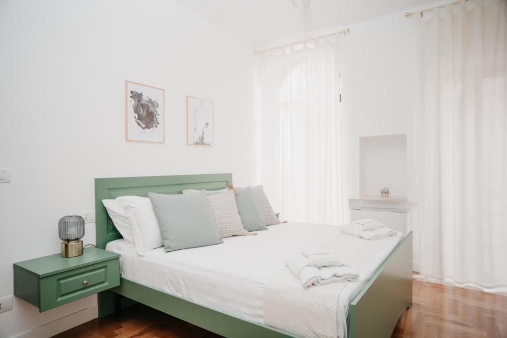 A bed or beds in a room at Vista Napoli Residence by Casa Napoletana