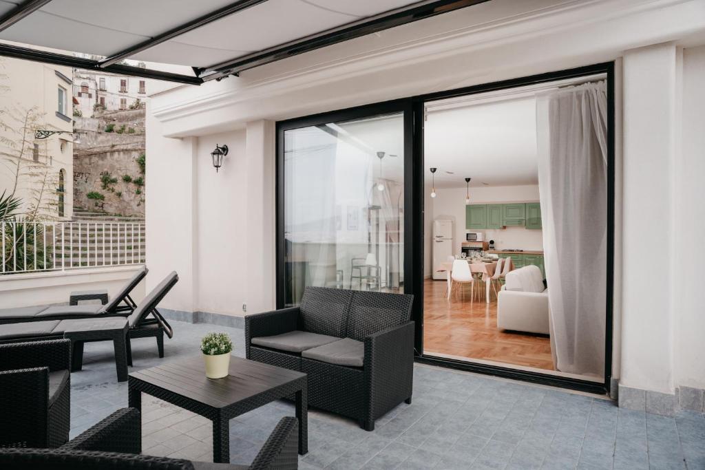 a living room with a couch and a table at Vista Napoli Residence by Casa Napoletana in Naples