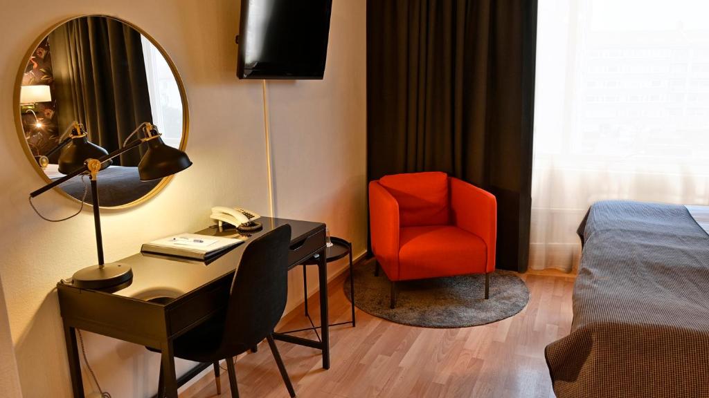 Televisyen dan/atau pusat hiburan di Hotel Amadeus by First