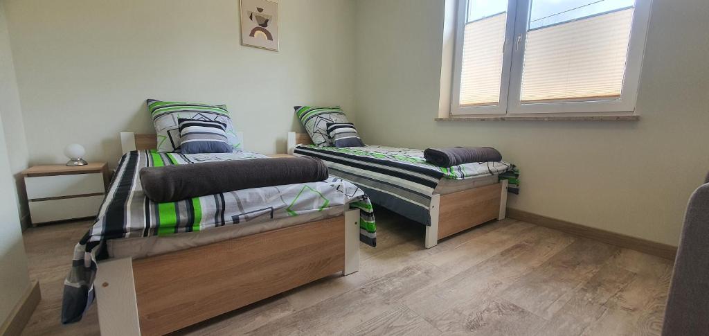 Postel nebo postele na pokoji v ubytování Zajazd Stronie