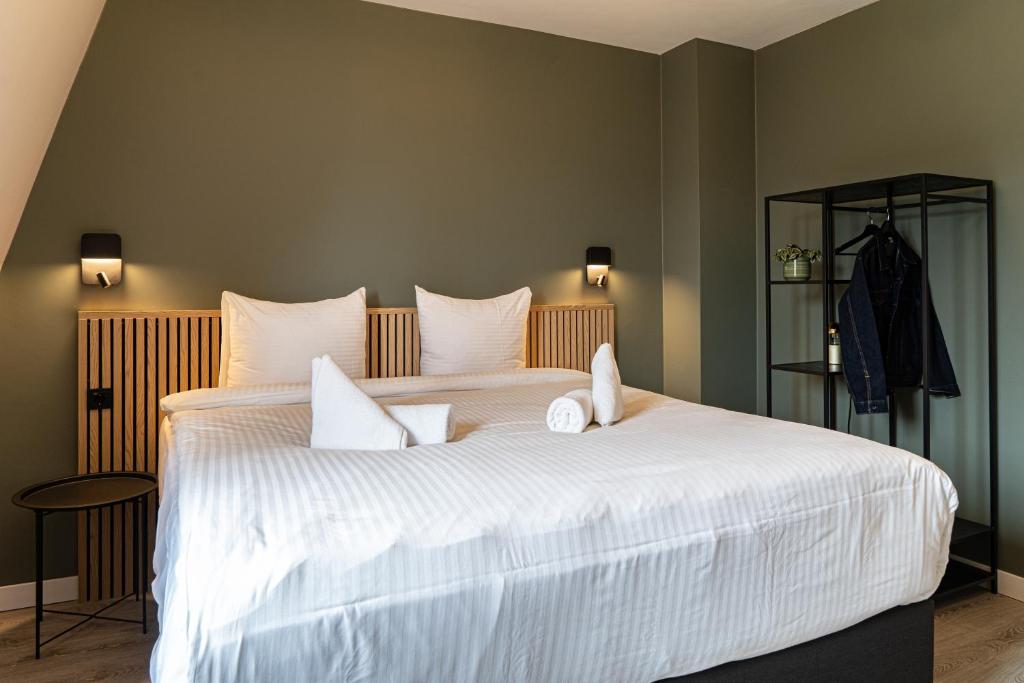 Postel nebo postele na pokoji v ubytování Hotel de Duif Lisse - Keukenhof