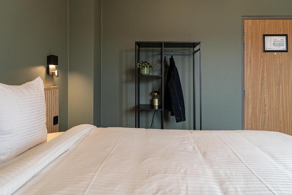 Postel nebo postele na pokoji v ubytování Hotel de Duif Lisse - Keukenhof