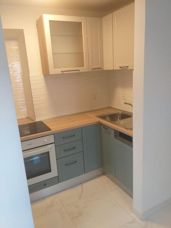 Kuchyň nebo kuchyňský kout v ubytování Apartments & Rooms Katarina