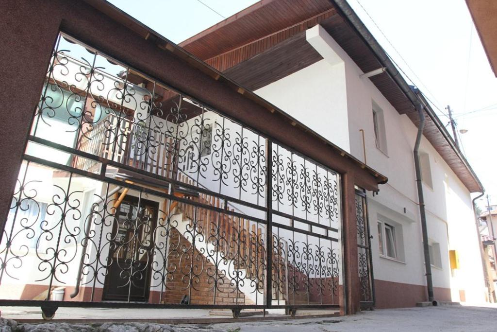 a building with an iron gate in front of it at Apartments Amy in Sarajevo