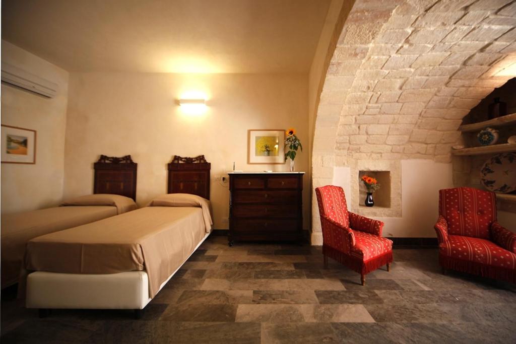 Postel nebo postele na pokoji v ubytování Hotel Dell'Orologio