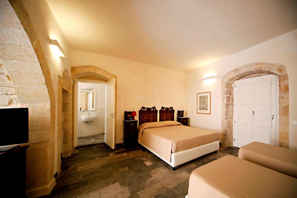 Postel nebo postele na pokoji v ubytování Hotel Dell'Orologio