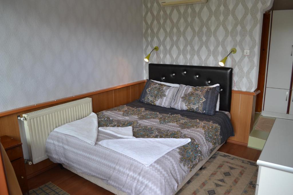 Giường trong phòng chung tại Aspawa Hotel