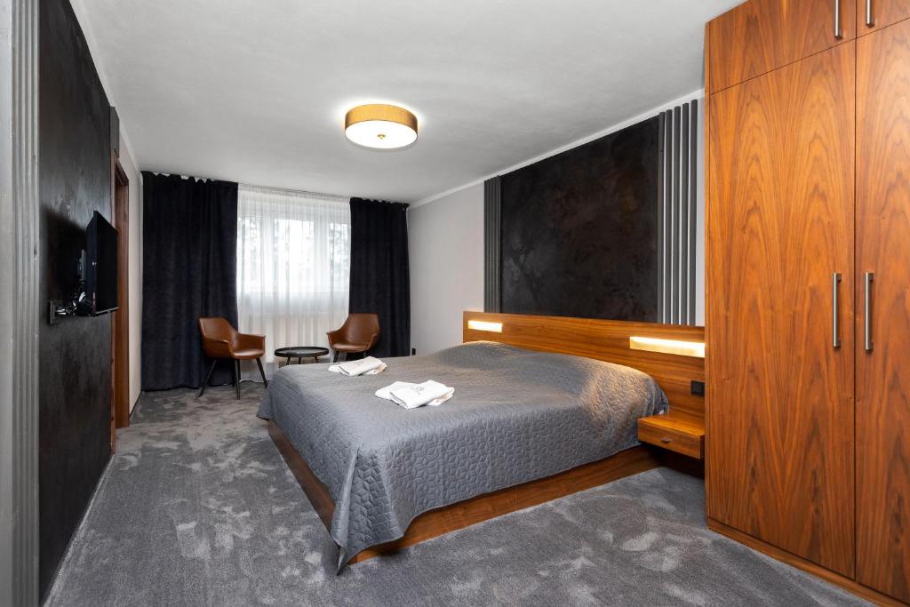 Postel nebo postele na pokoji v ubytování GARDEN Restaurant & Pension
