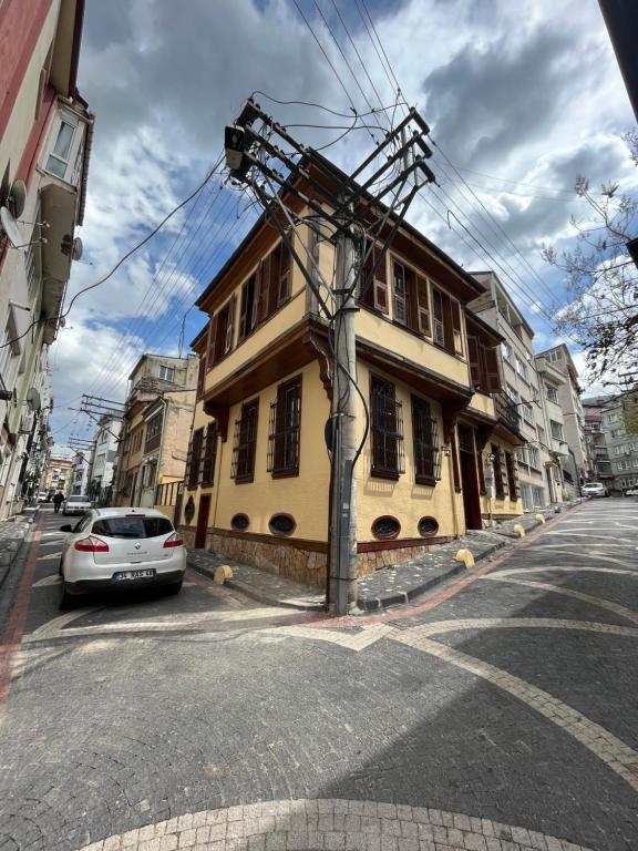 a car parked on a street next to a building at İnkaya hotel in Yıldırım