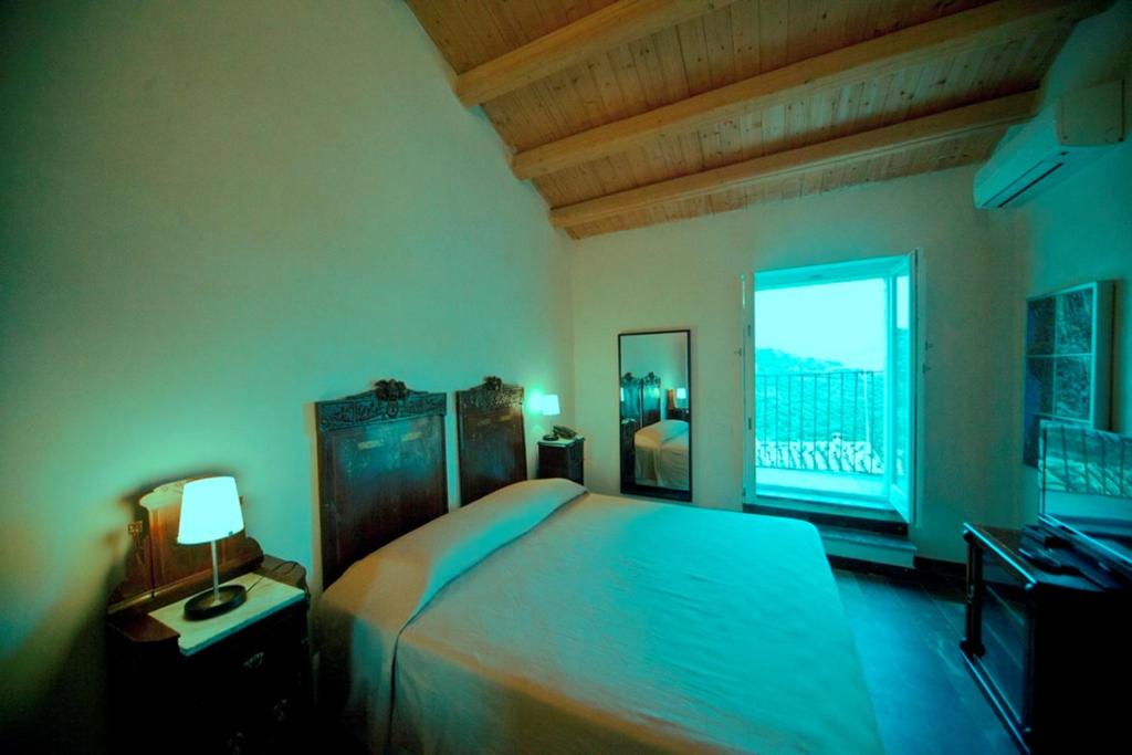 Postel nebo postele na pokoji v ubytování Hotel Dell'Orologio