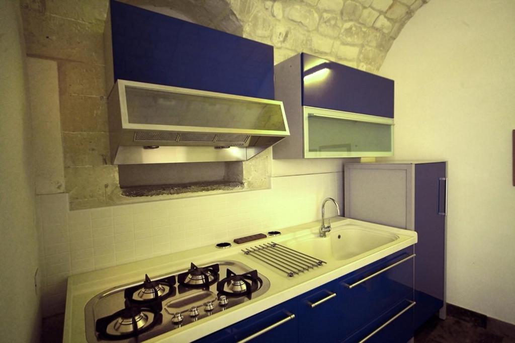 Kuchyň nebo kuchyňský kout v ubytování Hotel Dell'Orologio