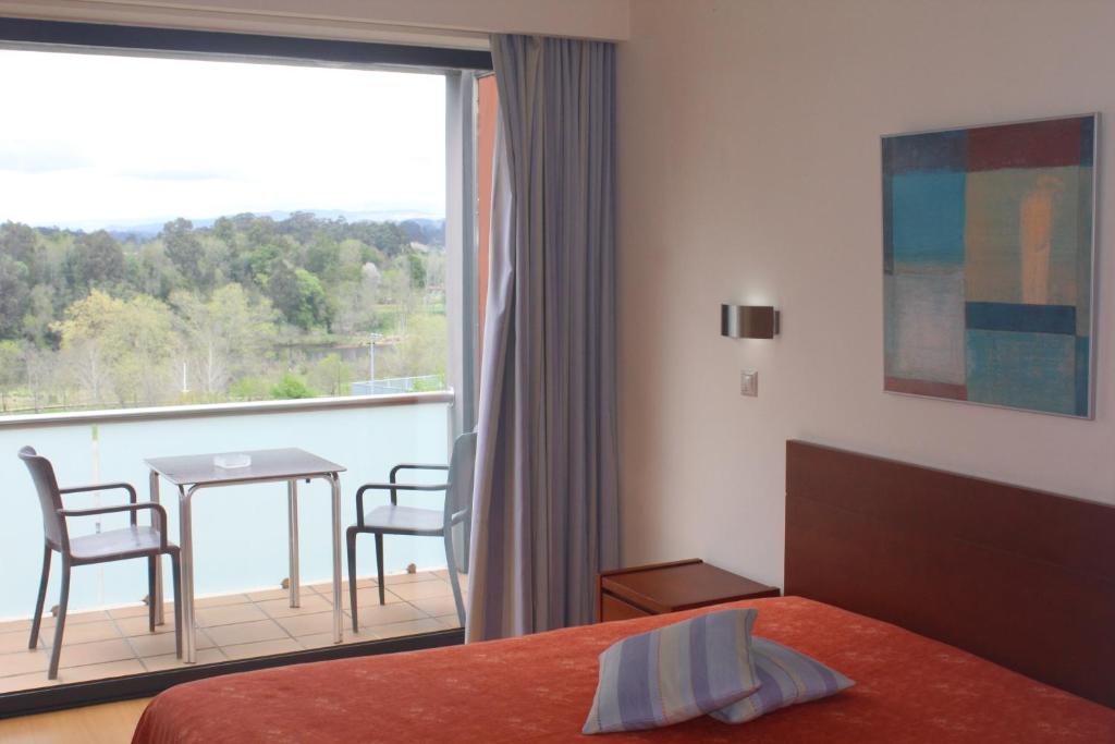 Postel nebo postele na pokoji v ubytování Hotel Dom Afonso - Monção