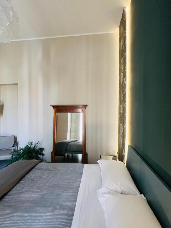 A bed or beds in a room at Catania Rooms
