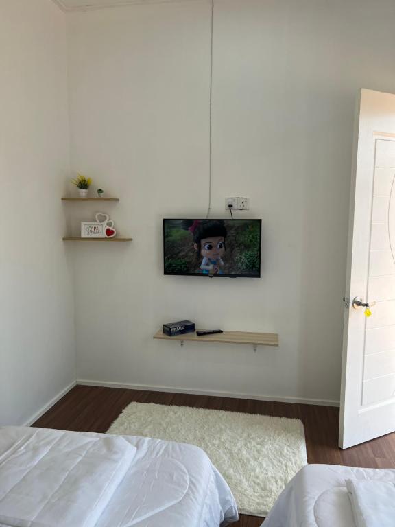 TV a/nebo společenská místnost v ubytování A’Casa Cottage