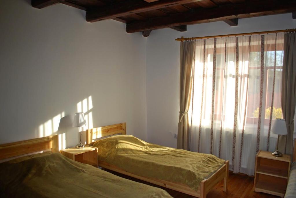 Postel nebo postele na pokoji v ubytování Guest House St. Mária
