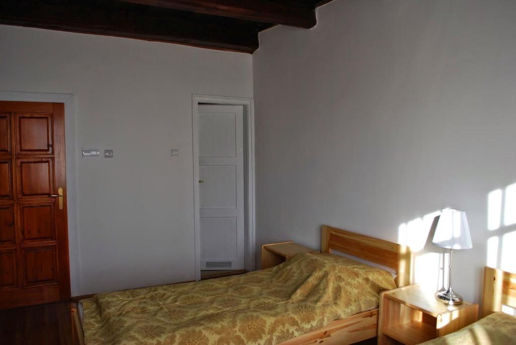 Postel nebo postele na pokoji v ubytování Guest House St. Mária