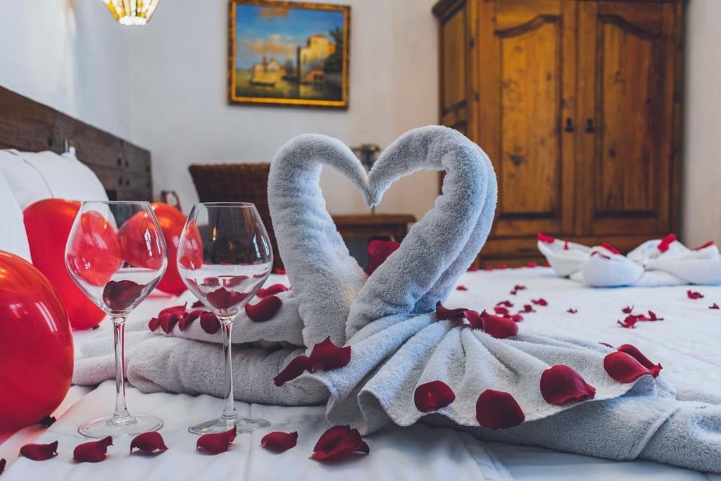 Postel nebo postele na pokoji v ubytování Hotel Boutique Casa Altamira