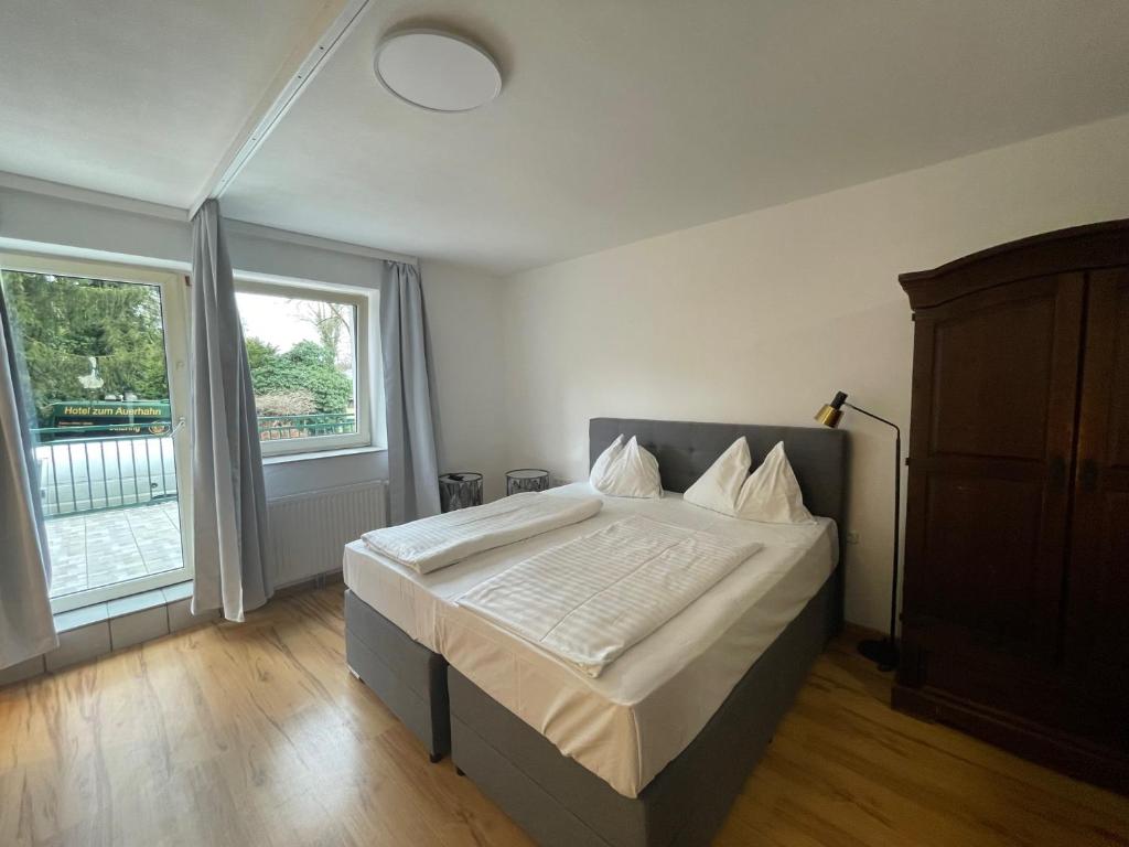 Postel nebo postele na pokoji v ubytování Ferienhaus Auerhahn