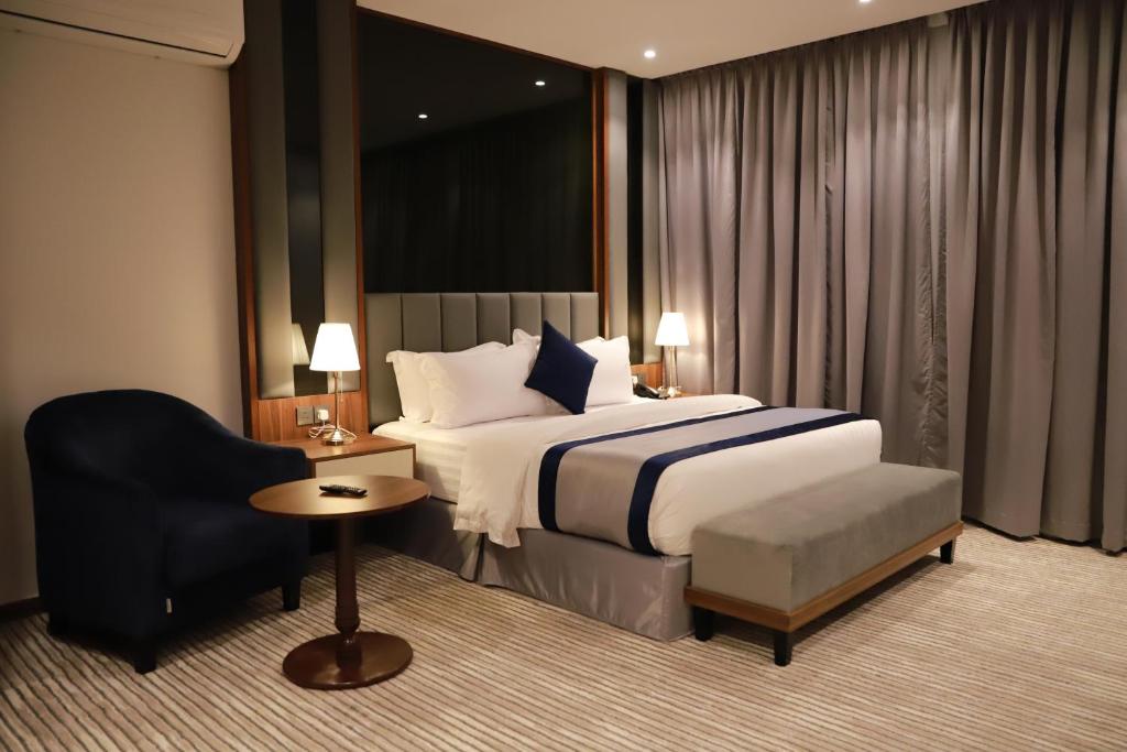 Postel nebo postele na pokoji v ubytování Tulip View Hotel