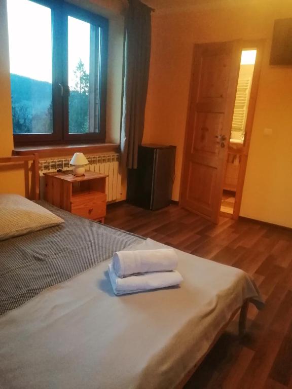 Postel nebo postele na pokoji v ubytování Noclegi Na Smaguli