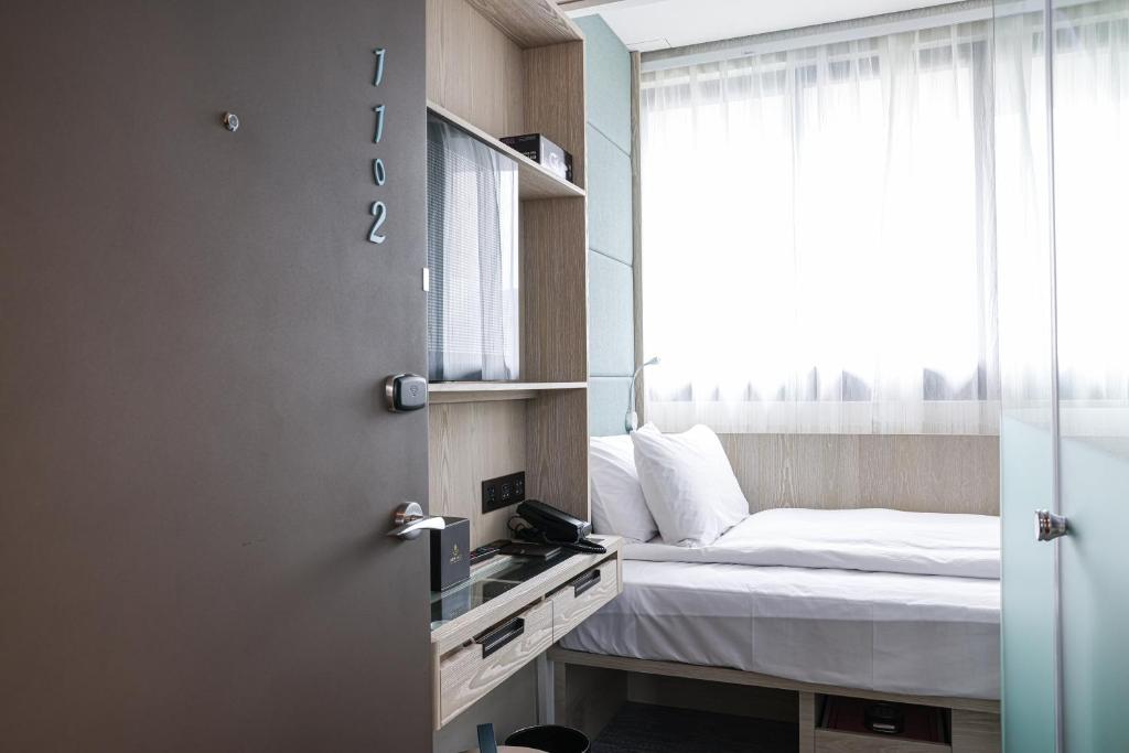Letto o letti in una camera di Royal Jade Boutique Hotel