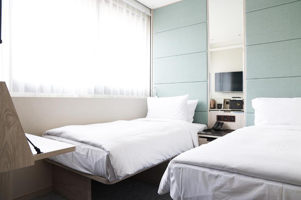Letto o letti in una camera di Royal Jade Boutique Hotel