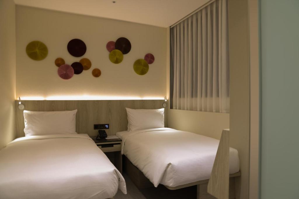 Letto o letti in una camera di Royal Jade Boutique Hotel