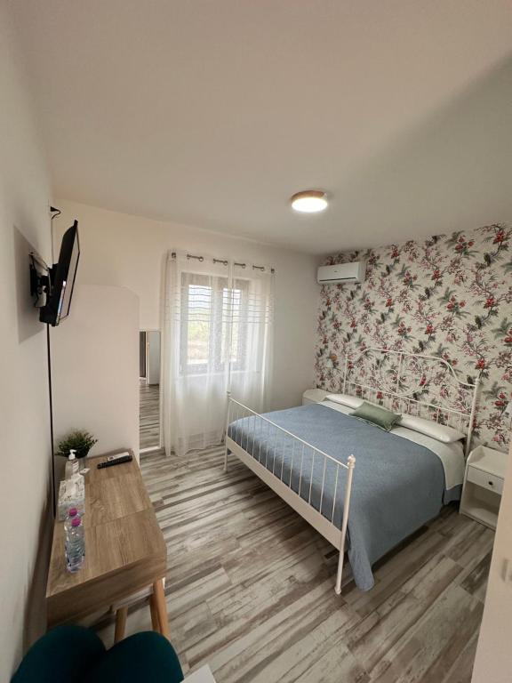 Postel nebo postele na pokoji v ubytování B&B Dimora delle Ninfee