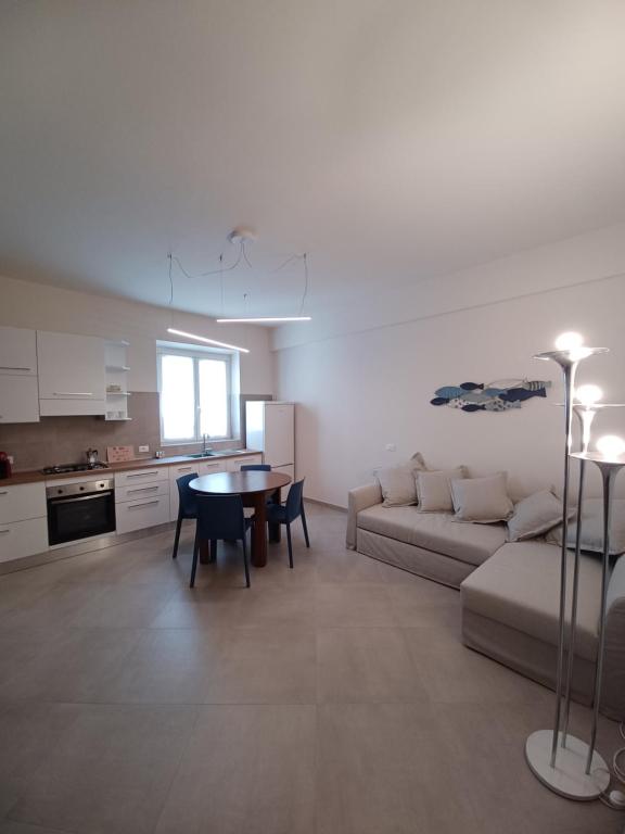 a living room with a couch and a table at Casa Lerici Holidays in Lerici