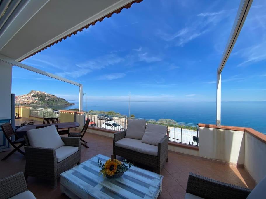 a balcony with a view of the ocean at Sunrise Apartment in Castelsardo
