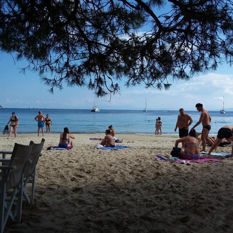 a group of people laying on the beach at Luxury House for all Seasons in Thessaloniki