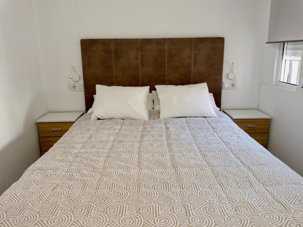 Posteľ alebo postele v izbe v ubytovaní Apartamento de Julia