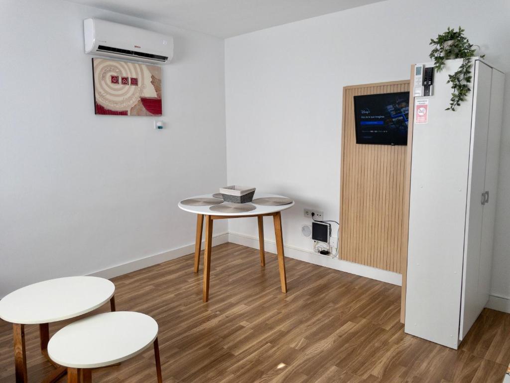 Televízia a/alebo spoločenská miestnosť v ubytovaní Apartamento de Julia