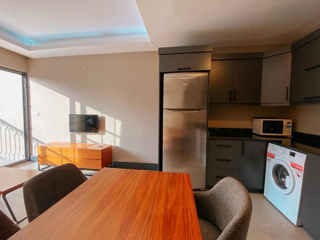 Kuchyň nebo kuchyňský kout v ubytování Ölüdeniz 1+1 Modern SummerHouse Wıth Swımmıng Pool