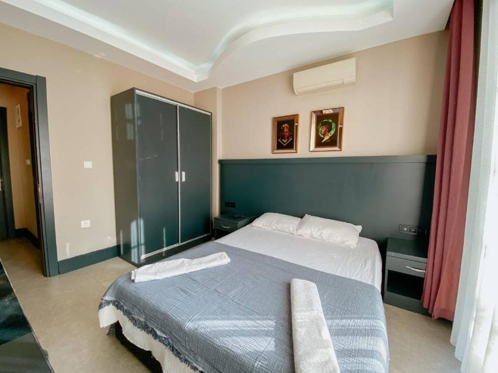 Postel nebo postele na pokoji v ubytování Ölüdeniz 1+1 Modern SummerHouse Wıth Swımmıng Pool