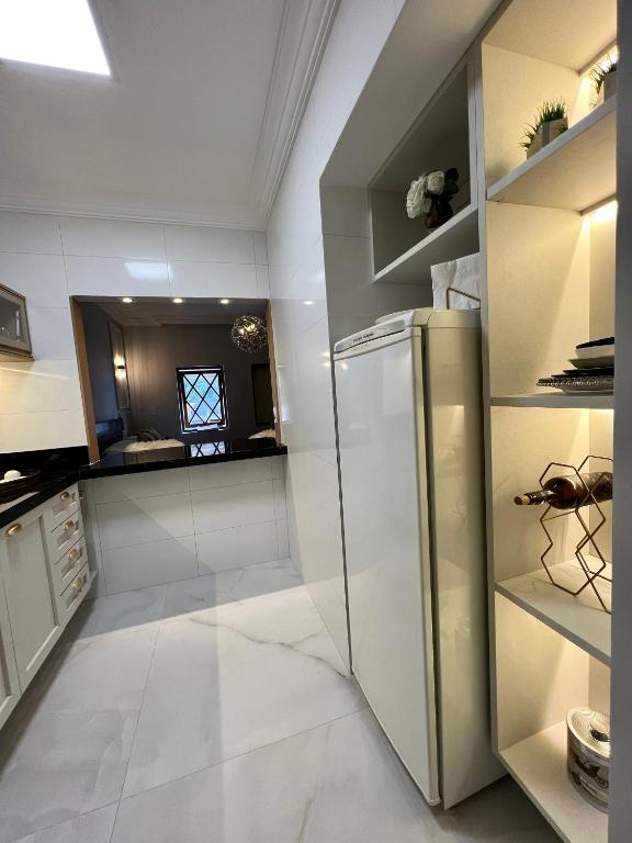 Kuchyň nebo kuchyňský kout v ubytování Flat Excepcional no Centro de Capivari