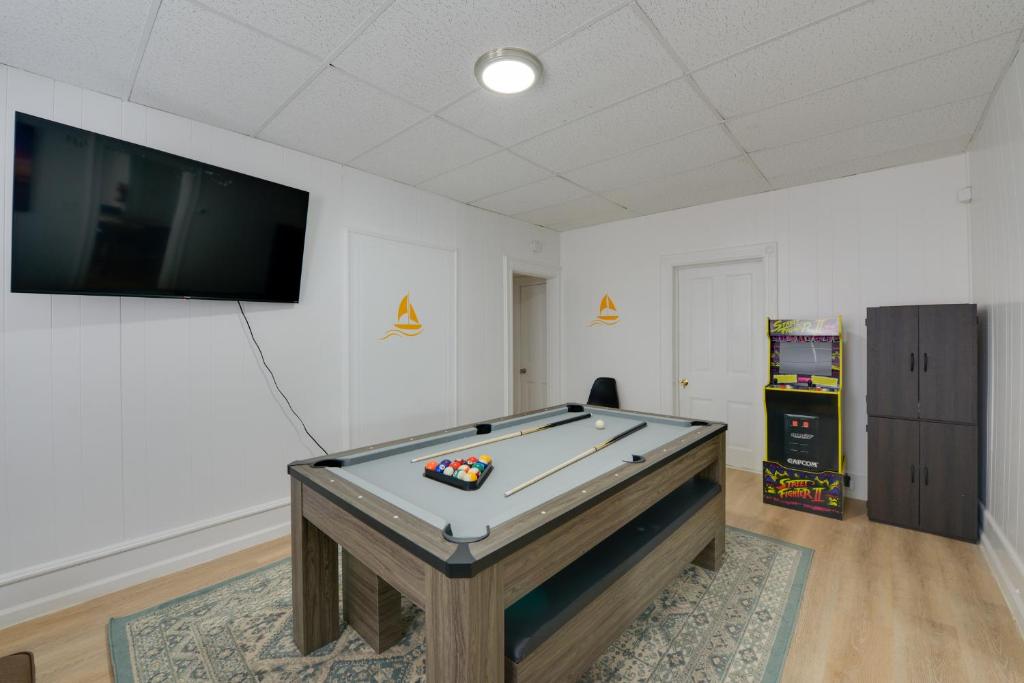 a room with a pool table and a flat screen tv at Pet-Friendly Vacation Rental in Atlantic City! in Atlantic City