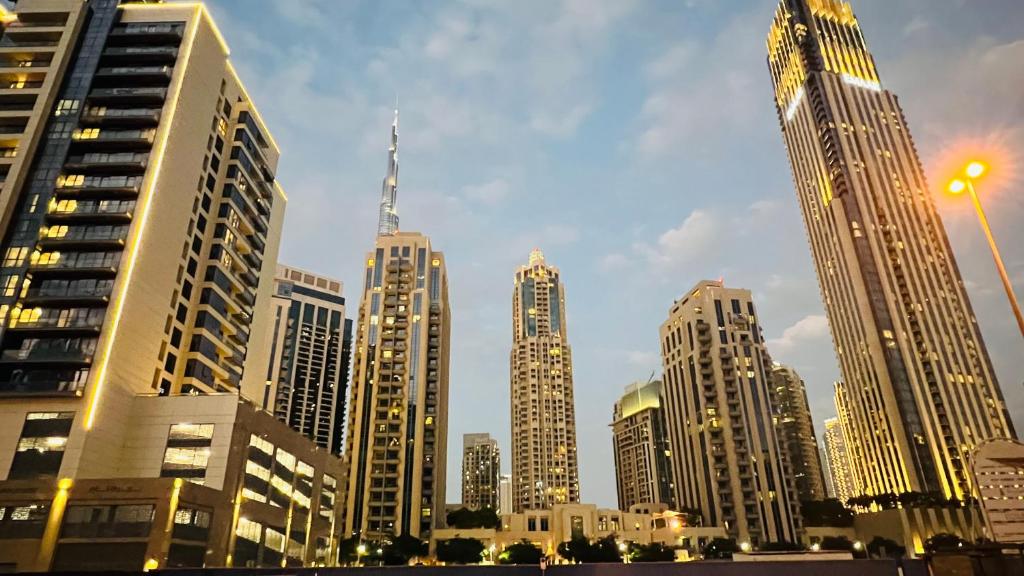 a group of tall buildings in a city at Dubai Star Hostel in Dubai