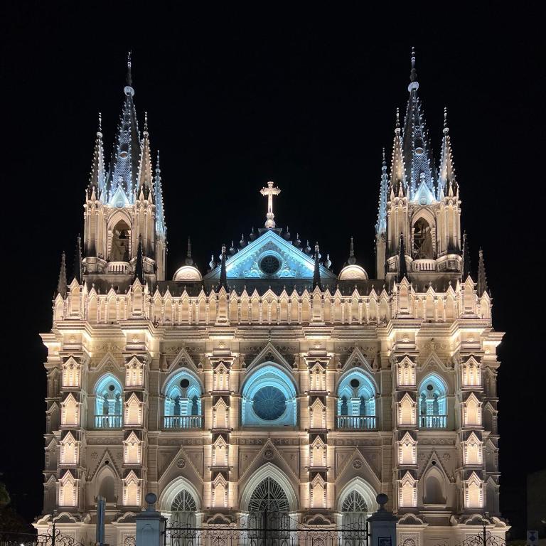 a large building with a cross on top of it at Casa Central de Santa Ana in Santa Ana