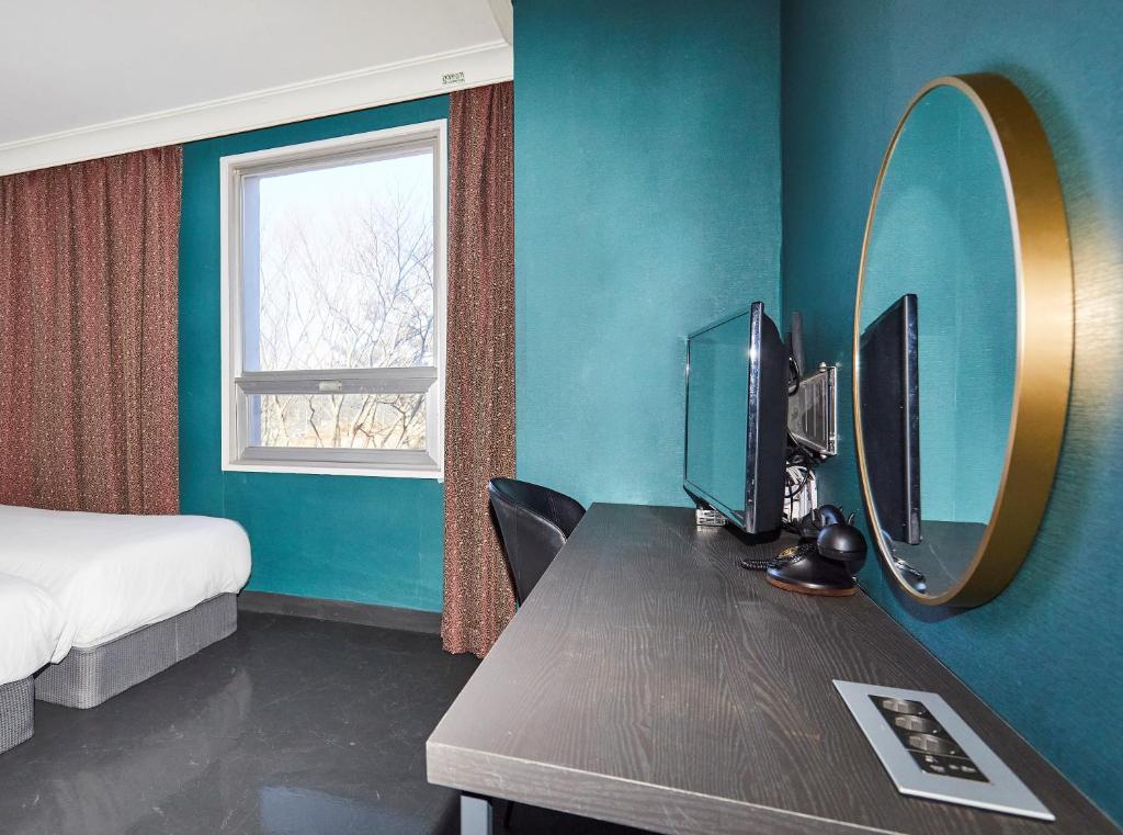 TV a/nebo společenská místnost v ubytování Kolon Hotel