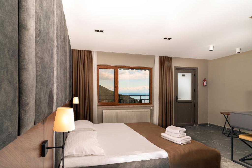 Postel nebo postele na pokoji v ubytování Assos Kartal Yuvasi Hotel