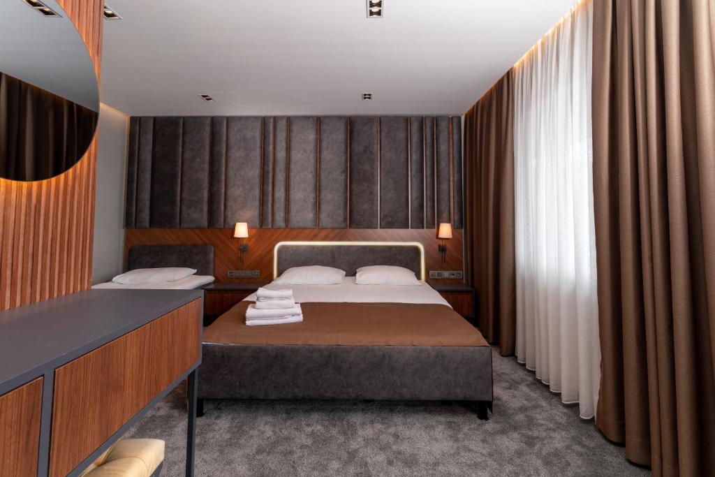 Postel nebo postele na pokoji v ubytování Assos Kartal Yuvasi Hotel