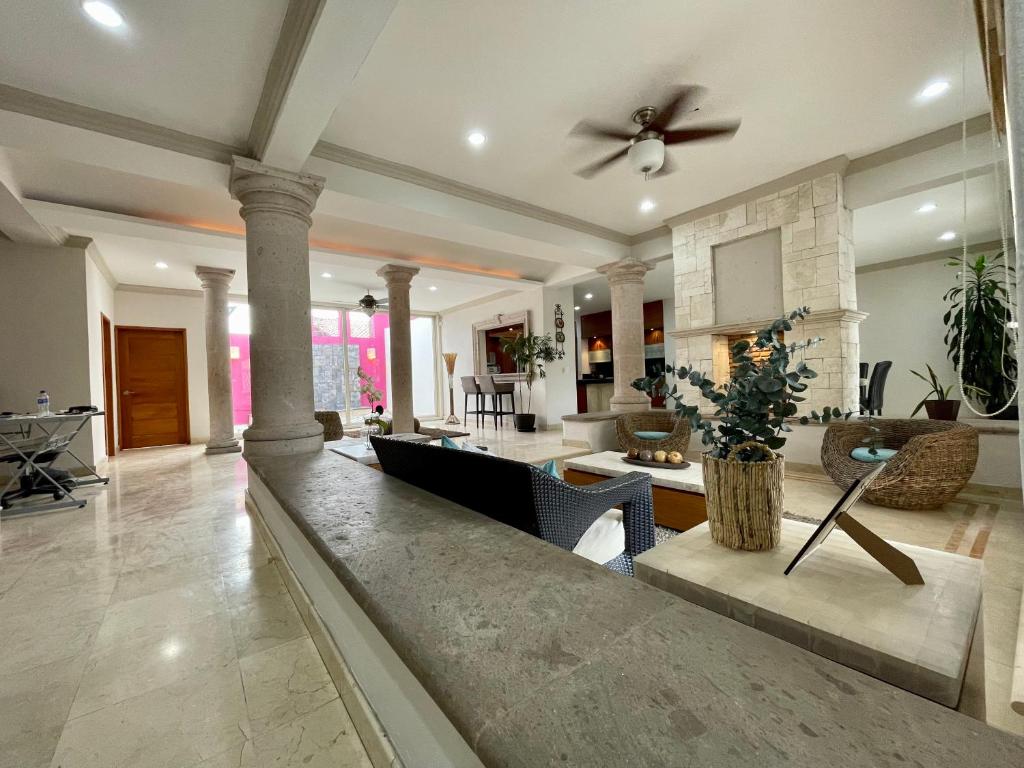 a large living room with a ceiling fan at Guerrero 318 in Puerto Vallarta