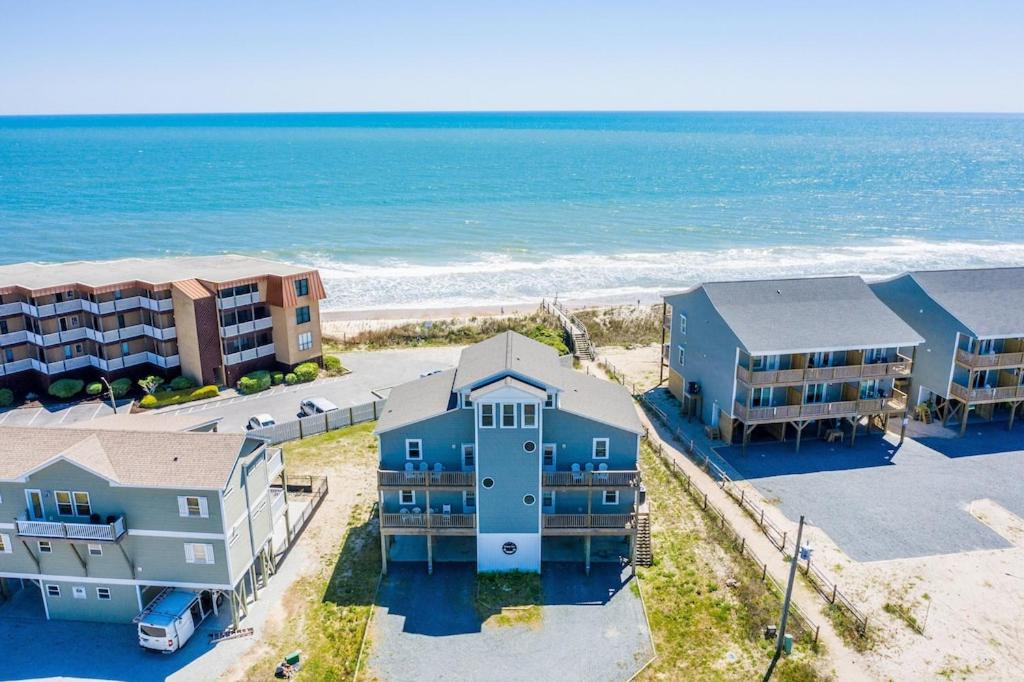 an aerial view of condos and the beach at Hang Zen - Beachfront Luxury 6 BR Hot Tub, Elevator in North Topsail Beach