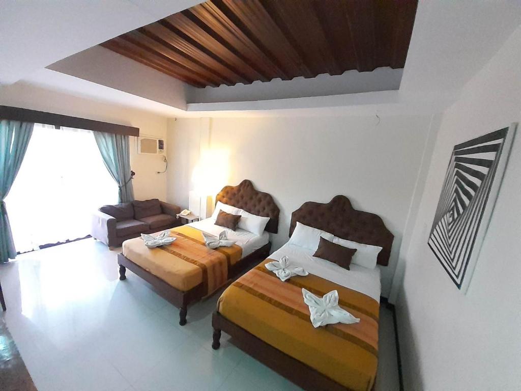 Postel nebo postele na pokoji v ubytování MelSol Hotel